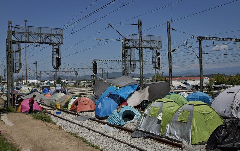 Tents at the migrant camp in Idomeni, Greece, are shown Monday on the railroad that links Greece and Macedonia.