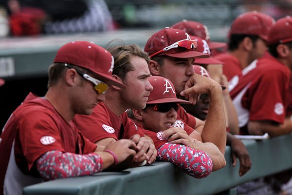 Arkansas baseball players watch from the dugout during the ninth inning of a loss to Alabama on Sunday, May 15, 2016, at Baum Stadium in Fayetteville. 