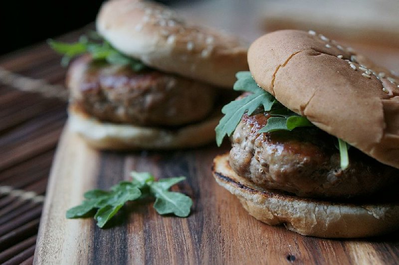 A pat of lemon-herb butter cooked inside the patty keeps these turkey burgers juicy and flavorful. 