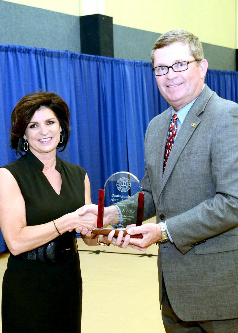 SPC Photo by Wes Underwood Deborah Alsup of Gravette, was recently named as a 2016 Distinguished Alumna of South Plains College. Also shown is Kelvin Sharp, president of South Plains College. She was honored during a special reception and the college&#8217;s Employee Recognition Banquet. South Plains College hosted the 58th Annual Commencement Ceremony Friday (May 13) in the Texan Dome.