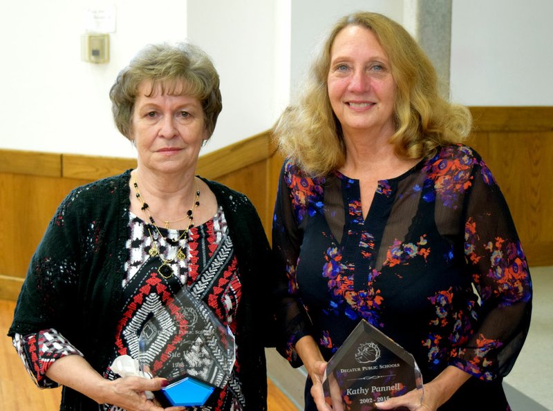 Photo by Mike Eckels Sara Verser (left) and Kathy Pannell were recognized for their years of service to the Decatur school system during a retirement party in the community room at Decatur City Hall May 16. Verser has been with the Decatur school for 30 years and Pannell, 14 years.