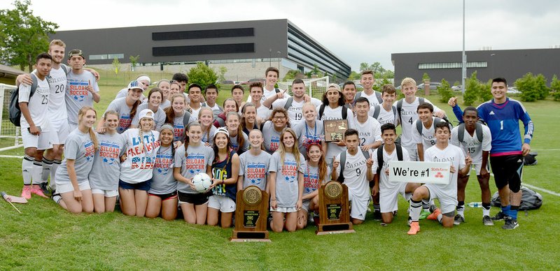 Bud Sullins/Special to the Herald-Leader The Siloam Springs boys and girls soccer teams posed for a photo Friday after both teams won 6A state titles with victories over Russellville at Razorback Field in Fayetteville.