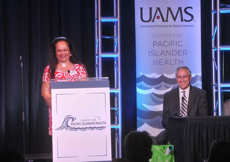 Nia Aitaoto, co-director for the Center for Pacific Islander Health at UAMS, and Dr. Dan Rahn, chancellor with the University of Arkansas for Medical Sciences (right) speak Tuesday during the first Gathering for Pacific Islander Health at the Fayetteville Town Center. The three-day conference gives medical professionals a chance to address health issues among Marshallese and other Pacific Islanders.