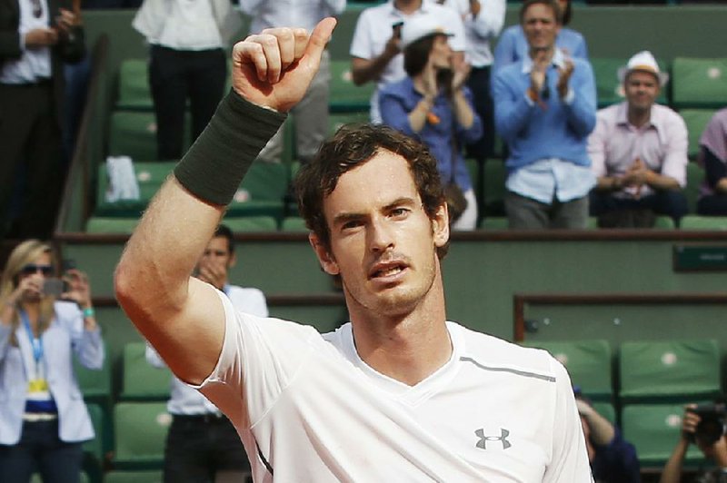 Britain's Andy Murray celebrates winning his second round match of the French Open tennis tournament against France’s Mathias Bourgue at the Roland Garros stadium in Paris, France, Wednesday, May 25, 2016. 