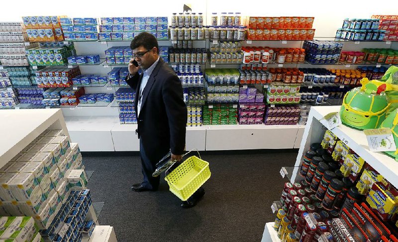 A Bayer employee walks through the employee shop at the company’s Whippany, N.J., facility in this file photo. Monsanto on Tuesday rejected Bayer’s $62 billion takeover offer.