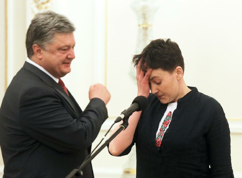 Ukrainian President Petro Poroshenko (left) talks with pilot Nadezhda Savchenko at his office in Kiev on Wednesday after Savchenko’s release by Russia, where she had been held for nearly two years. 