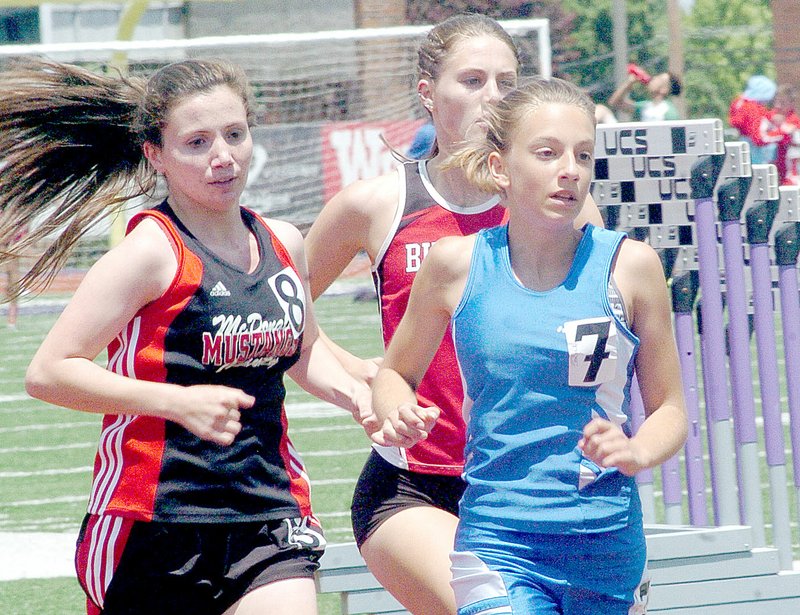 McDonald County&#x2019;s Emily High, left, runs with Kelie Henderson, right, of Bolivar, and Jelynn Tatum of Carl Junction during the 1600 meter run at Saturday&#x2019;s Class 4 Sectional 3 Track and Field Championships at Southwest Baptist University in Bolivar.