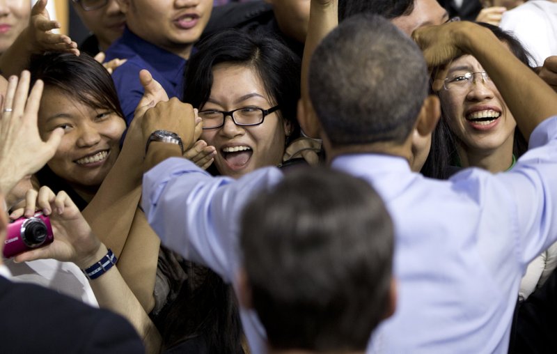 President Barack Obama greets the audience Wednesday after speaking at the Young Southeast Asian Leaders Initiative meeting in Ho Chi Minh City, Vietnam.