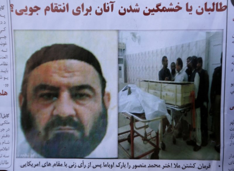 An Afghan newspaper headlines pictures of the former leader of the Afghan Taliban, Mullah Akhtar Mansoor, who was killed in a U.S. drone strike last week, in Kabul, Afghanistan, Wednesday, May 25, 2016.