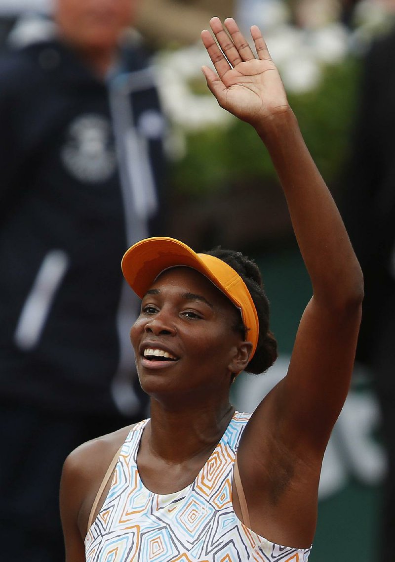 Venus Williams of the U.S. waves after defeating compatriot Louisa Chirico during their second round match of the French Open tennis tournament at the Roland Garros stadium, Thursday, May 26, 2016 in Paris.  