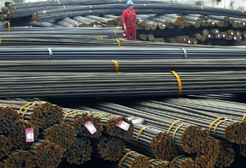 Steel was in abundance in a market in Yichang in central China’s Hubei province in April. China is trying to shrink its bloated industries, including steel, which has led to price-cutting wars. 