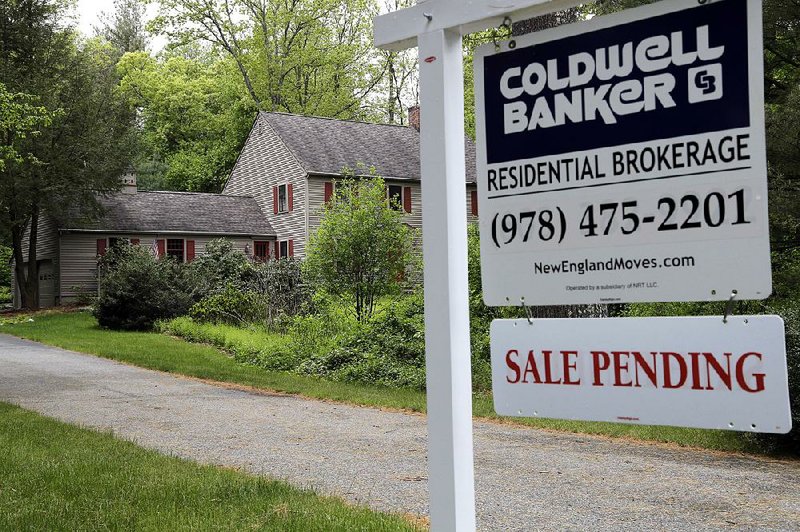 A “Sale Pending” sign stands outside a house in North Andover, Mass. The National Association of Realtors said Thursday that its index of pending home sales rose 5.1 percent in April. 
