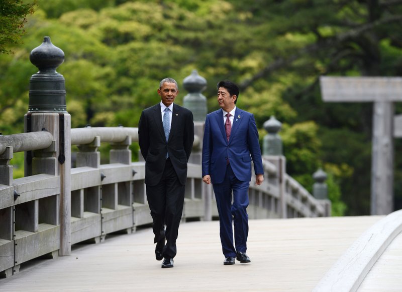 President Barack Obama and Japanese Prime Minister Shinzo Abe stroll Thursday through the grounds of Ise Jingu, a holy shrine of Japan’s indigenous Shinto religion. 