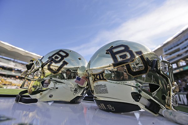 In this Dec. 5, 2015, file photo, Baylor helmets on shown the field after an NCAA college football game in Waco, Texas. Baylor University will look to rebuild its reputation and perhaps its football program after an outside review found administrators mishandled allegations of sexual assault and the team operated under the perception it was above the rules. (AP Photo/LM Otero, File)