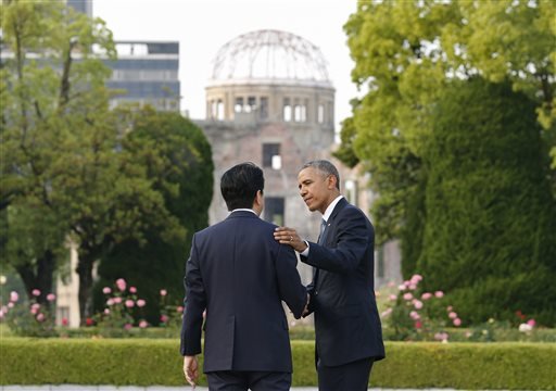 U.S. President Barack Obama, right, bids farewell to Japanese Prime Minister Shinzo Abe as they take a closer look at the Atomic Bomb Dome after laying wreaths at the cenotaph for victims of the 1945 atomic bombing at Hiroshima Peace Memorial Park in Hiroshima, western Japan, on Friday, May 27, 2016. 