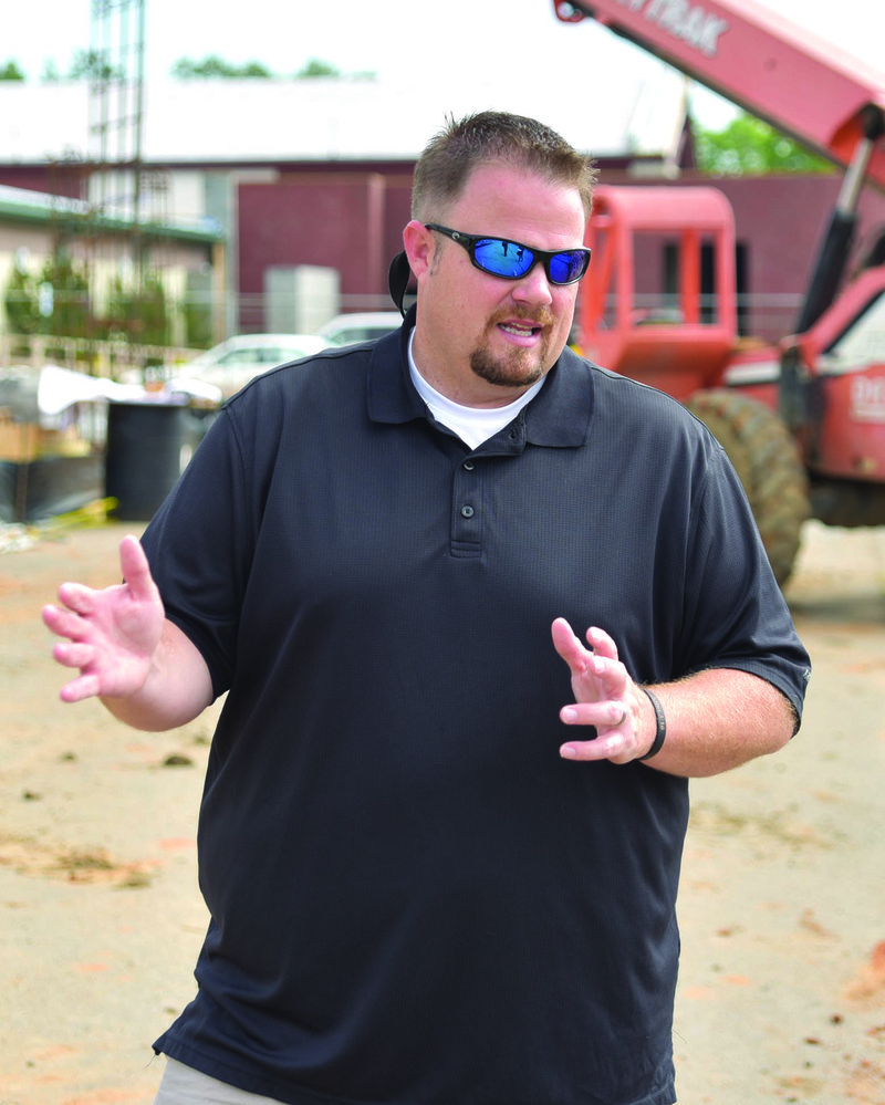 Travis Young, Cabot Parks and Recreation Department’s new general director, describes the renovation project that is underway at the Veterans Park Community Center. The center is expanding to add an aerobics room and a weight room, along with a banquet facility.