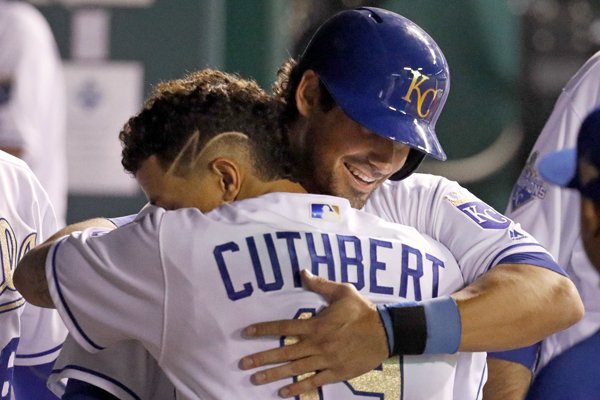 Kansas City Royals' Brett Eibner, right, celebrates with Cheslor Cuthbert after scoring on a two-run single by Whit Merrifield during the seventh inning of a baseball game against the Chicago White Sox, Friday, May 27, 2016, in Kansas City, Mo. The game was Eibner's major league debut. (AP Photo/Charlie Riedel)