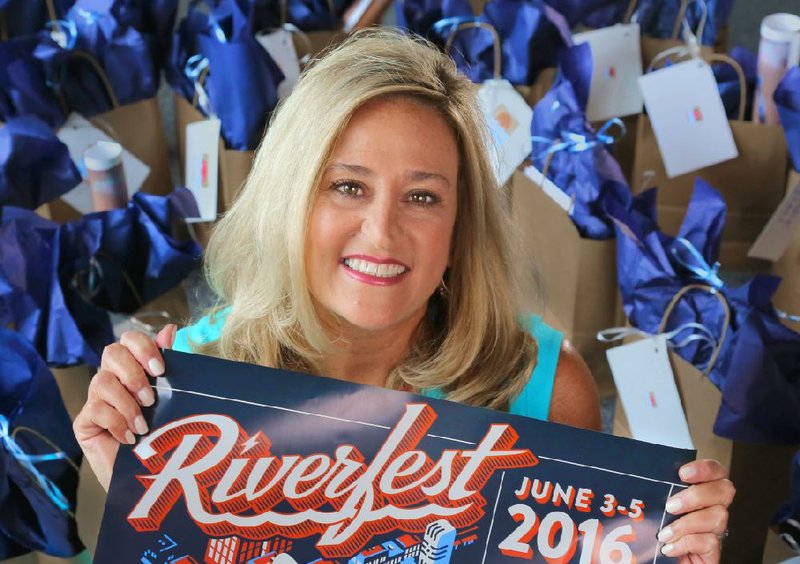 “It’s like summer camp, only with hard labor,” Riverfest Executive Director DeAnna Korte says of the three-day music and fun festival. 