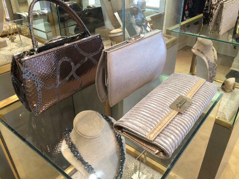 Handbags from the Ella McHugh line are displayed at a May 10-11 trunk show at B. Barnett. 