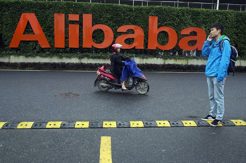 Traffic passes Alibaba Group headquarters in Hangzhou in eastern China’s Zhejiang province on Friday. 