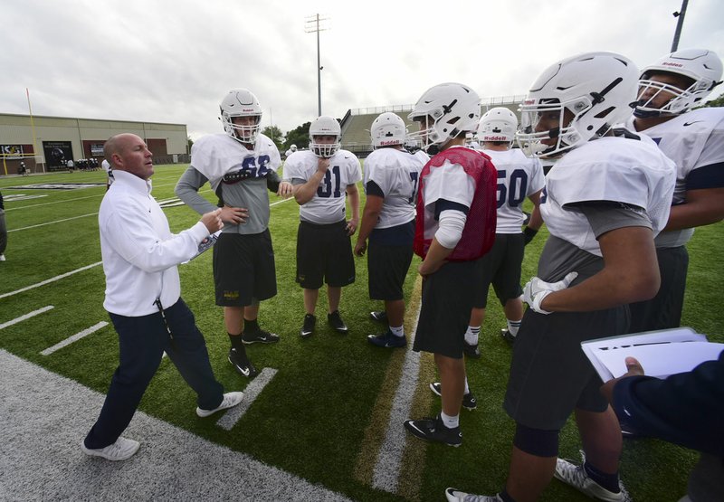 Bryan Pratt, Bentonville West football coach, speaks with his team May 18.