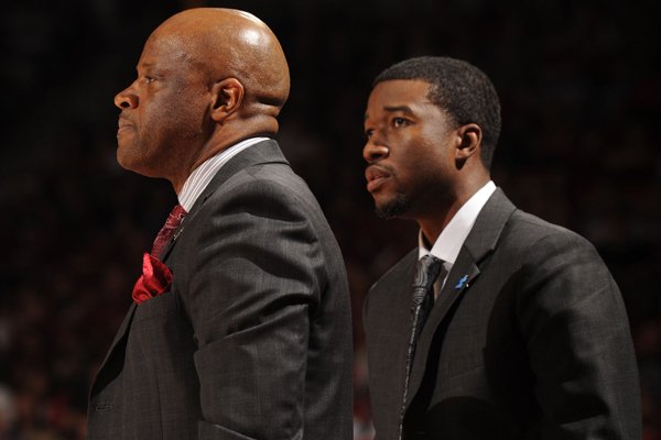 Arkansas coach Mike Anderson (left) and assistant coach T.J. Cleveland direct their team against Missouri Saturday, Feb. 20, 2016, during the second half of play in Bud Walton Arena in Fayetteville.