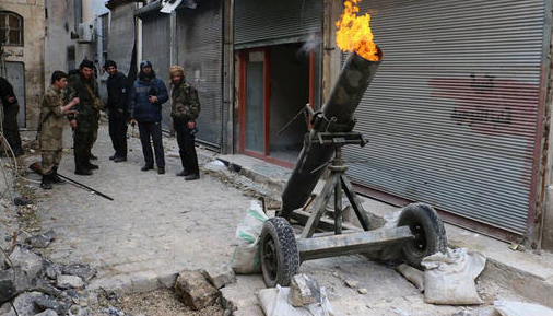 This Sunday Feb. 15, 2015, file photo provided on by the Syrian anti-government activist group Aleppo Media Center shows Syrian rebels firing locally made shells against the Syrian government forces, in Aleppo, Syria. 