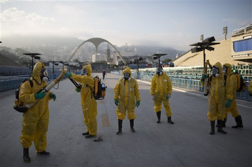 Health workers get ready to spray insecticide on Jan. 26 to combat mosquitoes that transmit the Zika virus under the bleachers of the Sambadrome in Rio de Janeiro, which will be used for the Archery competition in the 2016 summer games. 