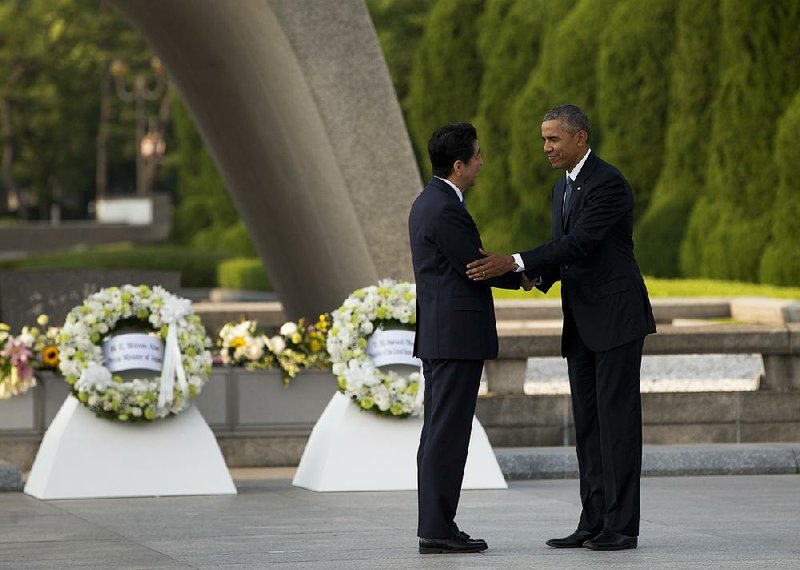 President Barack Obama and Japanese Prime Minister Shinzo Abe each placed wreaths Friday in Peace Memorial Park in Hiroshima, Japan. Late into the night, Japanese people lined up to file past and take pictures of the wreath Obama left. 