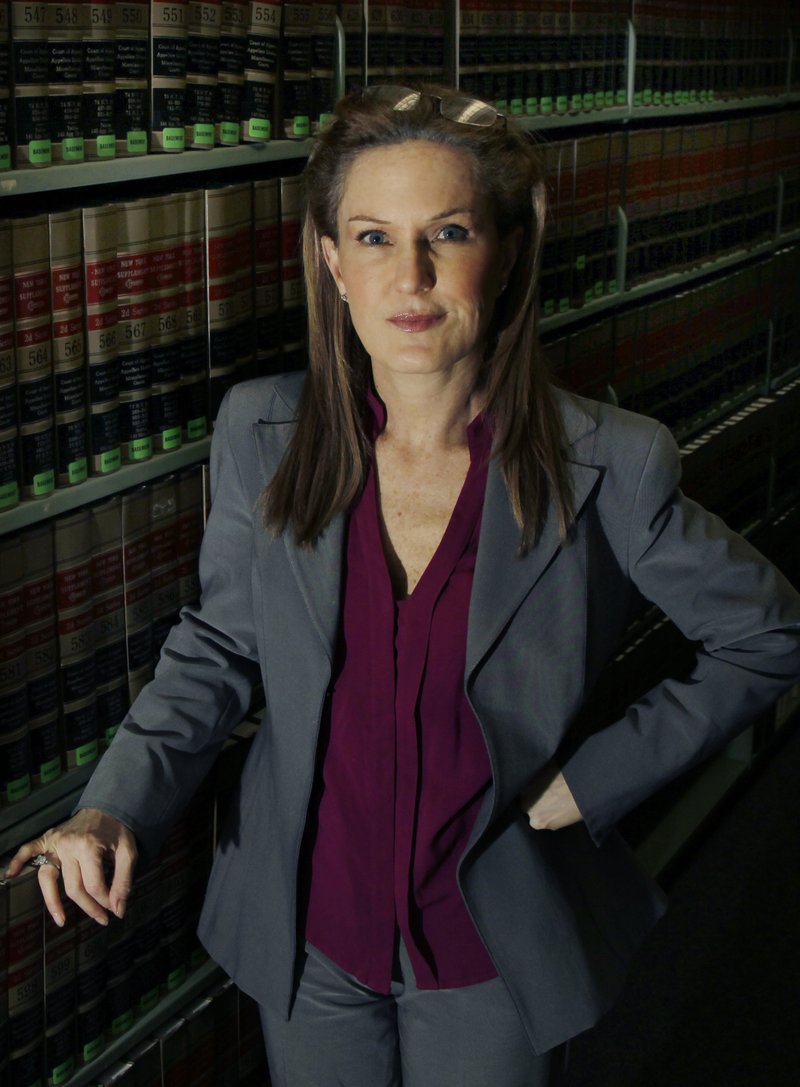 This Wednesday, March 14, 2012 photo shows attorney Wendy Murphy in the law library at the New England School of Law in Boston. As colleges nationwide face increasing pressure to aggressively investigate reports of sex assaults, some advocates think they've found a way to restore what they say is much-needed balance between the rights of the accuser and the accused. 