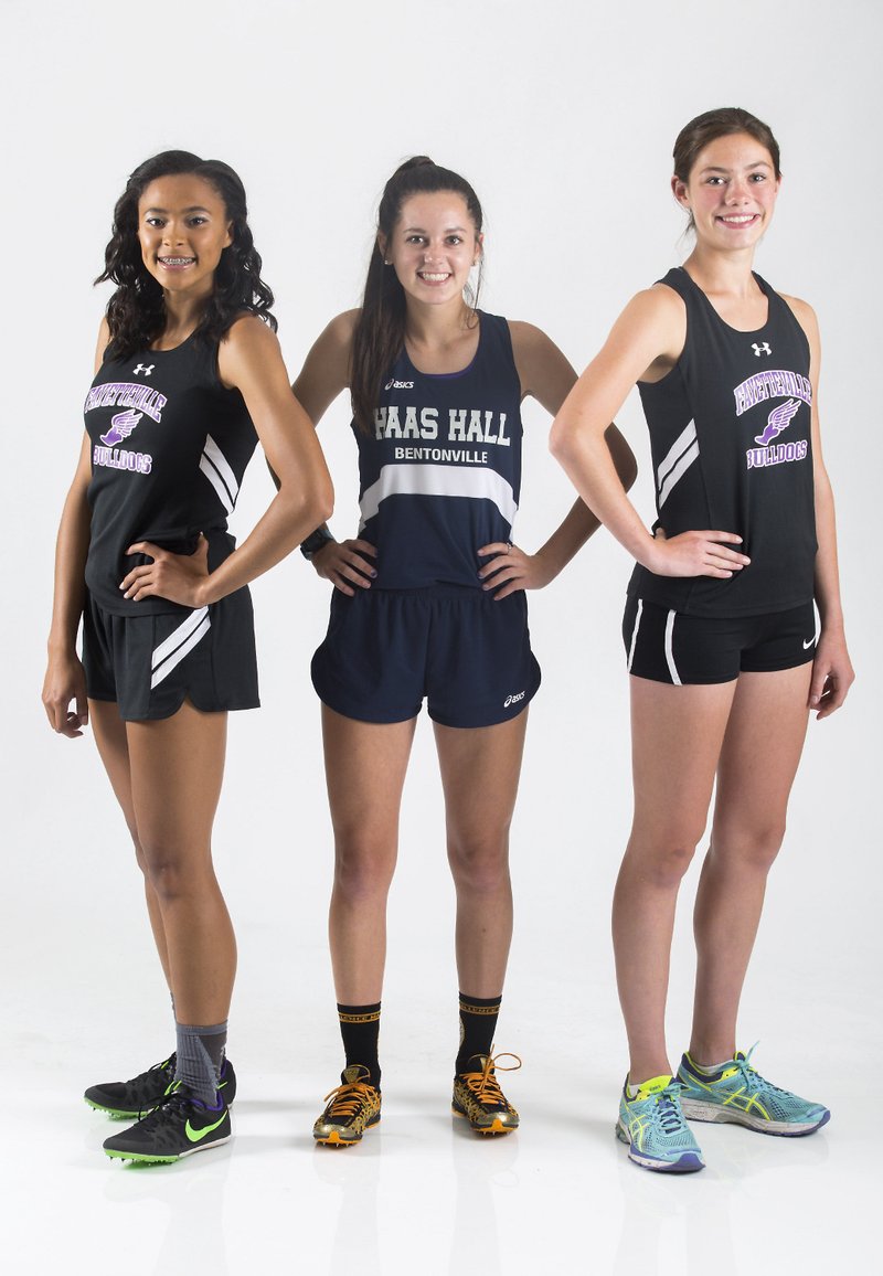 Fayetteville’s Lauren Holmes (from left) (athlete of the year), Bentonville Haas Hall’s Tori Willis (newcomer of the year) and Fayetteville’s Rebecca Boushelle (runner of the year)