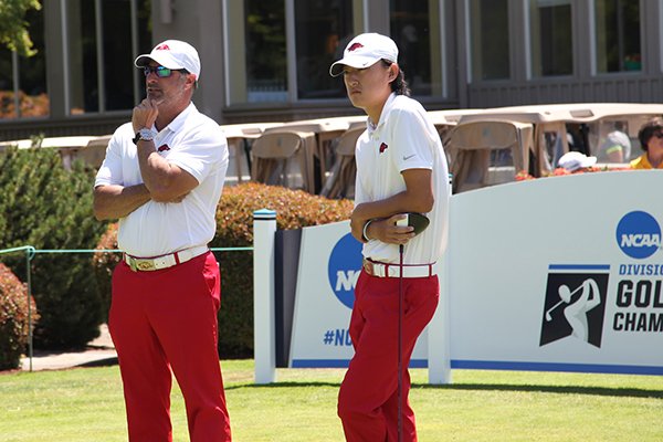 Arkansas coach Brad McMakin, left, talks with Charles Kim during the second round of the NCAA Championships on Saturday, May 28, 2016, at Eugene Country Club in Eugene, Ore. 