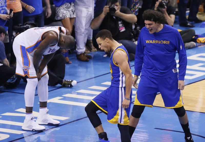 Golden State Warriors guard Stephen Curry (30) and forward Anderson Varejao (18) celebrate as Oklahoma City Thunder forward Serge Ibaka (9) reacts during the second half in Game 6 of the NBA basketball Western Conference finals in Oklahoma City, Saturday, May 28, 2016. The Warriors won 108-101. 