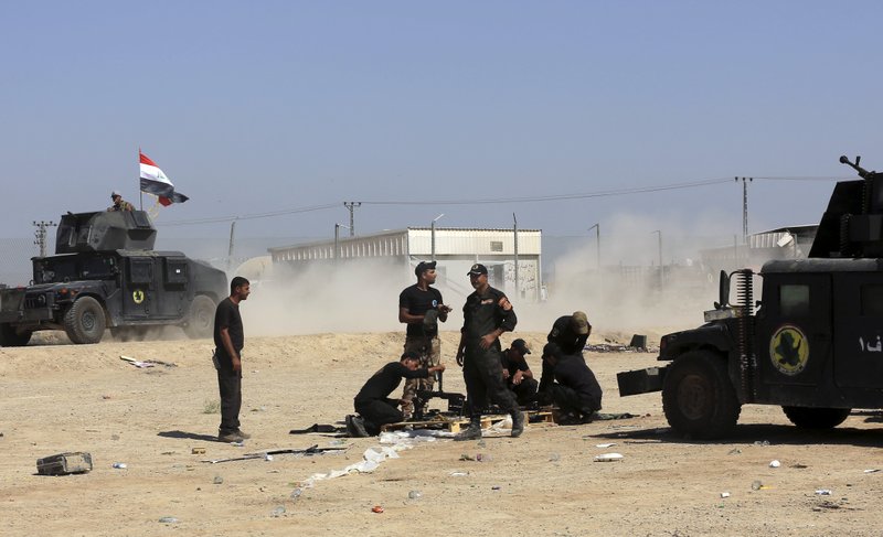 Iraqi counterterrorism forces clean their weapons Sunday as they prepare for an operation to retake the Islamic State-held city of Fallujah.