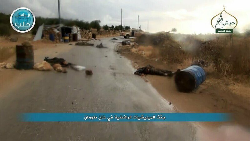 This image posted on the Twitter page of Syria's al-Qaida-linked Nusra Front on Thursday, May 12, 2016, shows bodies of Syrian government soldiers and pro-government militiamen who were killed during a battle against Nusra Front fighters, in the town of Khan Touman, near Aleppo province, Syria.  
