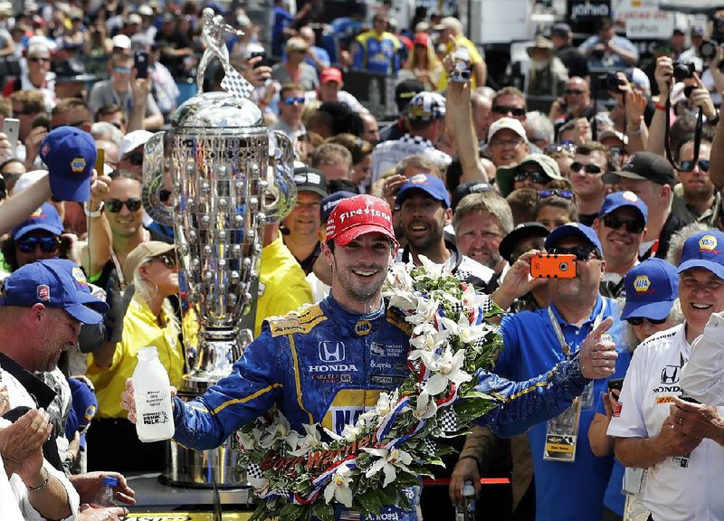 Alexander Rossi celebrates after winning the 100th running of the Indianapolis 500 auto race at Indianapolis Motor Speedway in Indianapolis, Sunday, May 29, 2016. 