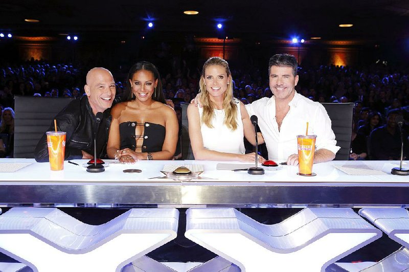 America’s Got Talent judges for Season 11 are (from left) Howie Mandel, Mel B, Heidi Klum and Simon Cowell.
