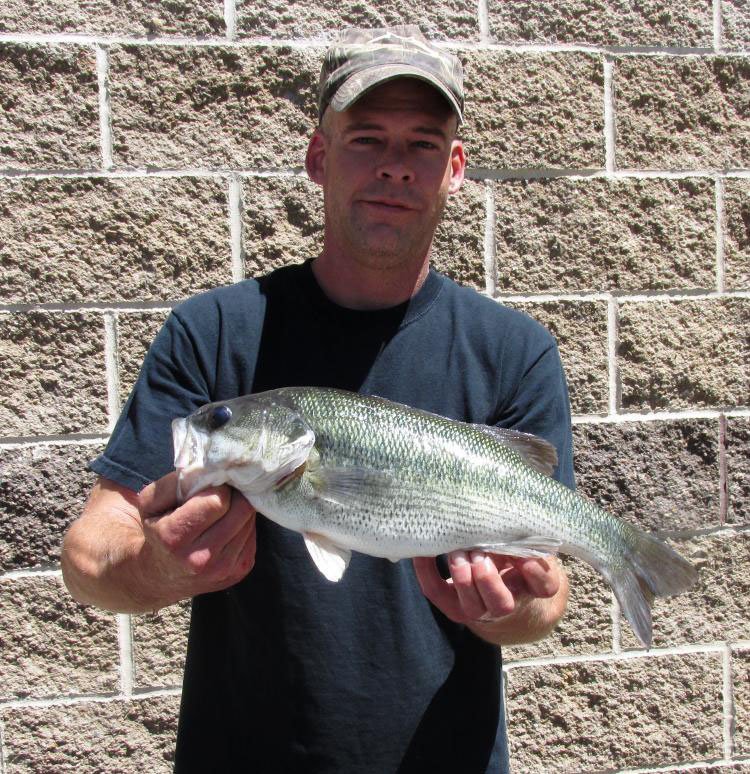 Jason Reynolds shows his Missouri record spotted bass.