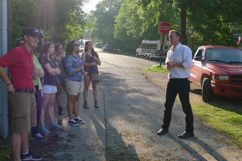 Dakota Buck leads a ghost tour Wednesday in front of Penn castle in Eureka Springs. Neighbors have complained Haunted Eureka Springs, the tour company, is disrupting the peace and quiet of the historic neighborhood, particularly with the nighttime tour.