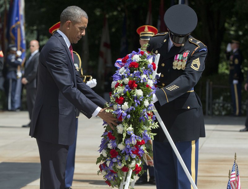 President Barack Obama lays a wreath at the Tomb of the Unknowns on Monday at Arlington National Cemetery in Virginia.