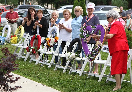 The Sentinel-Record/Lorien E. Dahl REMEMBER: Wreaths are placed to honor fallen United States soldiers during the community's annual Memorial Day service held Monday at the Garland County Veterans Memorial and Military Park. Retired Lt. Col. Hugh L. Mills Jr. was the featured speaker.
