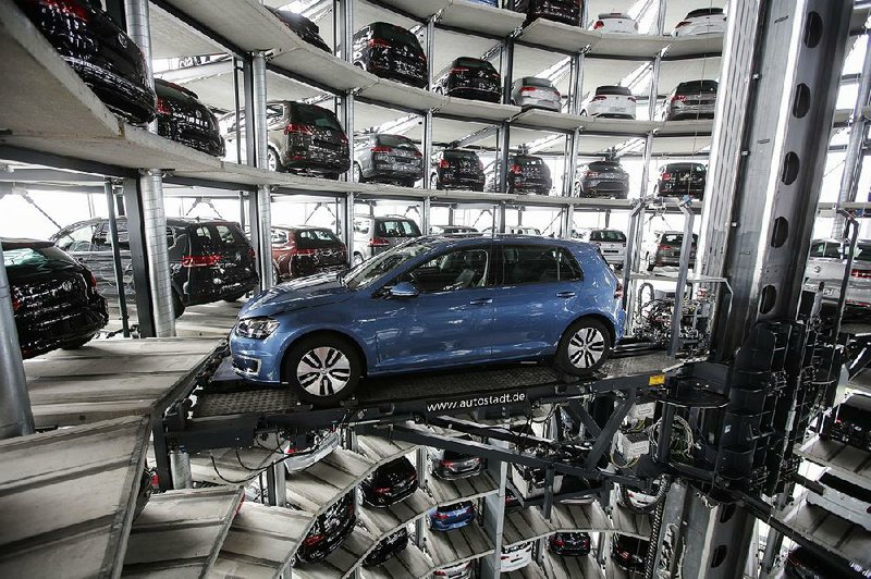 A Volkswagen Golf is displayed in April at the company’s annual news conference in Wolfsburg, Germany. Volkswagen on Tuesday reported a fi rst-quarter profit of $2.7 billion. 