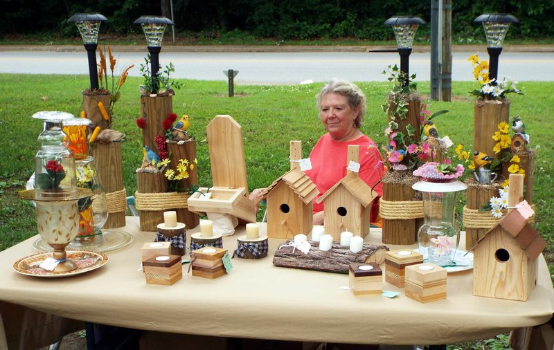 Photo by Randy Moll Barbara Lucciarini was selling a variety of hand-crafted items, including bird houses, lamps and other home decorations Thursday afternoon at the Gentry Farmers&#8217; Market, located on the south side of the Gentry City Park.