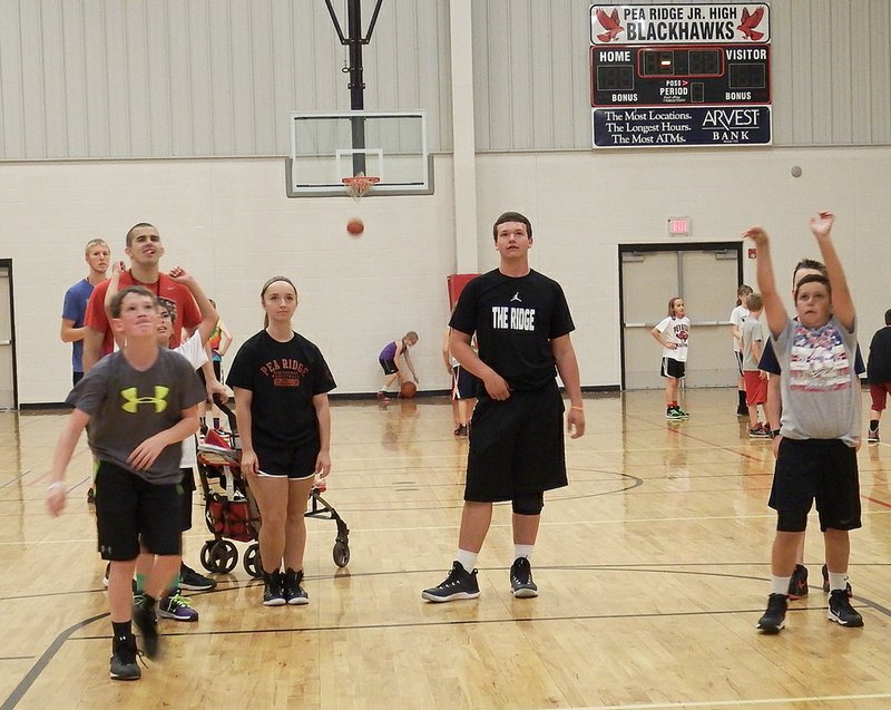 TIMES file photograph During the 2015 Little &#8217;Hawks basketball camp, then junior Blackhawk Chandler Tidwell and senior Melanie Beehler were two of the coaches.