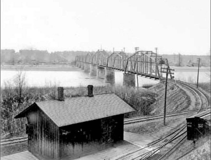This circa 1920 photograph of the completed railroad bridge at Van Buren was taken from the front yard of the Drennen-Scott house. Shown are the completed piers and steel-frame bridge. Images of America Van Buren, by Tom Wing, includes a step-by-step look at the construction of the bridge in the late 1800s.