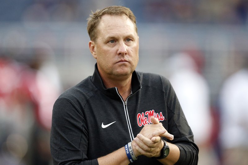 FILE - In this Oct. 24, 2015, file photo, Mississippi football coach Hugh Freeze watches his team warmup before an NCAA college football game against Texas A&amp;M in Oxford, Miss. Speaking at the Southeastern Conferences annual meetings Tuesday, May 31, 2016, Freeze delivered a lengthy, prepared statement and then took several questions about violations involving first-round NFL draft pick Laremy Tunsil. (AP Photo/Rogelio V. Solis, File)