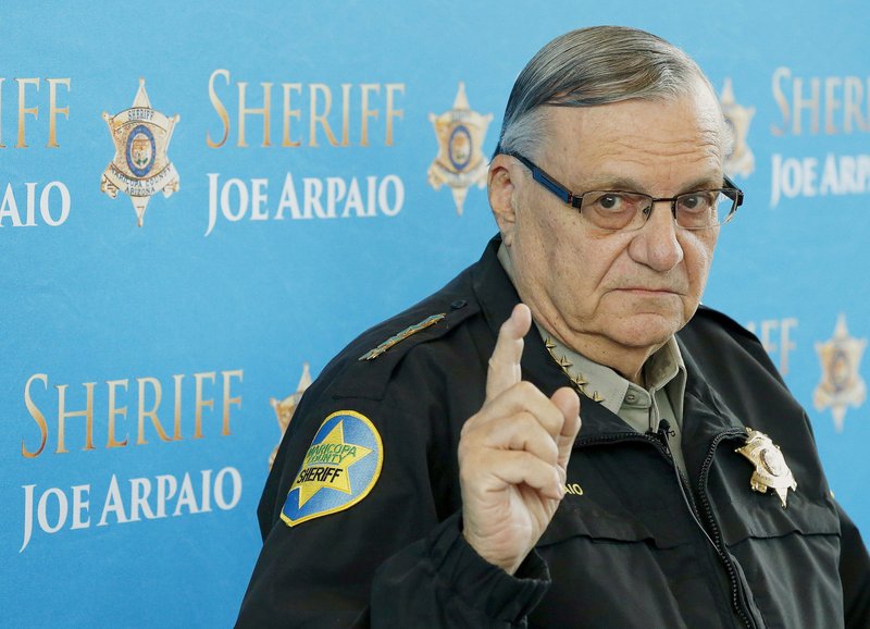 In this Dec. 18, 2013, file photo, Maricopa County Sheriff Joe Arpaio speaks at a news conference at the Sheriff's headquarters in Phoenix. A federal judge will hold a hearing Tuesday, May 31, 2016, to examine ways to address the Maricopa County sheriff's contempt-of-court violations in a racial profiling case. 