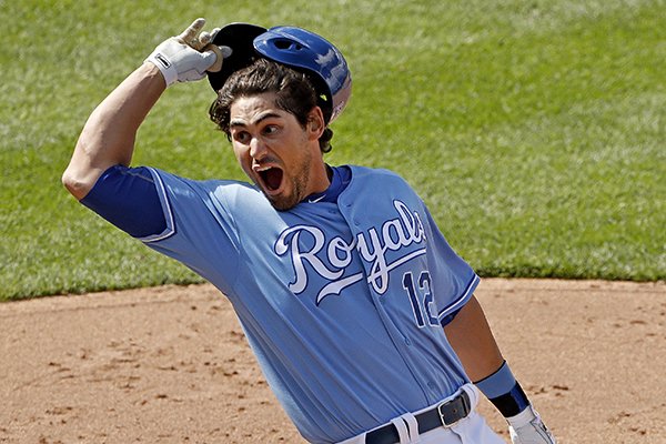 Kansas City Royals' Brett Eibner celebrates after hitting the game-winning single during the ninth inning of a baseball game against the Chicago White Sox on Saturday, May 28, 2016, in Kansas City, Mo. The Royals won 8-7. (AP Photo/Charlie Riedel)