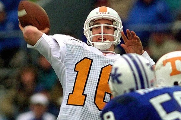 In this Nov. 22, 1997, file photo, Tennessee quarterback Peyton Manning launches a pass during the second half of his team's 59-31 win over Kentucky in an NCAA college football game in Lexington, Ky. Manning, Marshall Faulk and Steve Spurrier will be on the College Football Hall of Fame ballot for the first time this year. The National Football Foundation released Wednesday, June 1, 2016, the names of 75 former players and six retired coaches who competed in FBS that will be up for election to the hall of fame. (AP Photo/Ed Reinke, File)