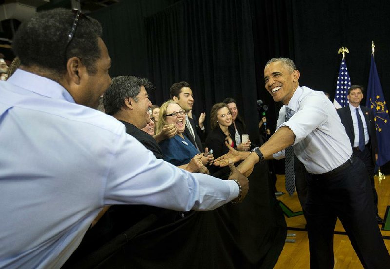 President Barack Obama greets audience members Wednesday before speaking at Concord Community High School in Elkhart, Ind. 